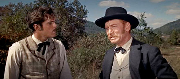 Jeffrey Hunter as William A. Fuller and Kenneth Tobey as Anthony Murphy, exhausted from trying to run down a stolen locomotive in The Great Locomotive Chase (1956)