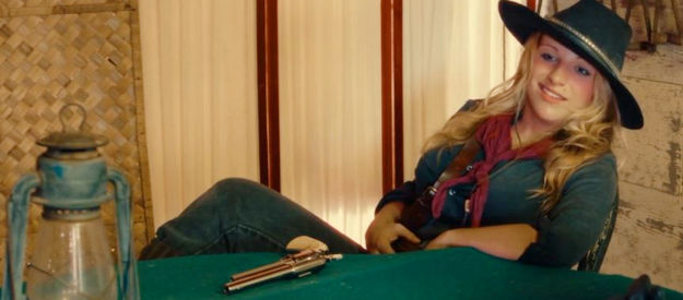 Alana Phillips as Blink, the woman who collected her first bounty on her own husband in Death After Dusk (2024)