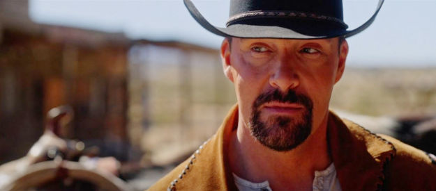 Alexander Nevsky as Max, the stranger who arrives in Goldwood hoping to make money gambling in The Wide West (2025)