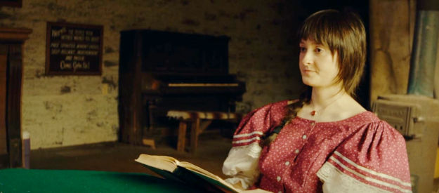 Alison Long as Anna, the sheriff's daughter, unknowingly talking to the Buck Creek killer in her dad's tavern in Death After Dusk (2024)