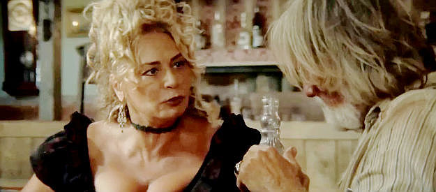 Ana Rita Del Piano as Serena, Django's mom, fretting over the possible loss of her brothel in Django Undisputed (2025)