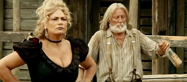 Anna Rite Del Piano as Serena and Ottaviano Dell'Acqua as Frankie, ready to confront Thomas about a debt they say they've already paid off in Django Undisputed (2025)