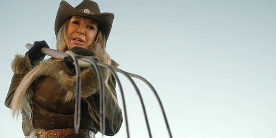 Cynthia Rothrock as Rose Jennings, demanding answers with a pitchfork in Black Creek (2024)