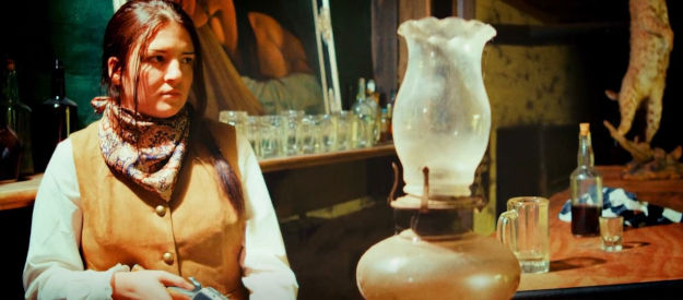 Katerina Townsend as sheriff's daughter Sarah, about to get embroiled in the violence in Death After Dusk (2024)