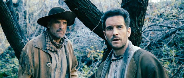 Kirin Stone and Nick Apostolides as fur trappers, sensing opportunity as Washoe approaches in The Company of Thieves (2025)