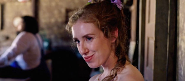 Madelyn Allen as Sally, a saloon girl exchanging glances with sumo wrestler Daiki in The Wide West (2025)