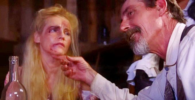 Brent Rock as gang leader Nate Jones with one of his victims in Showdown on the Brazos (2025)