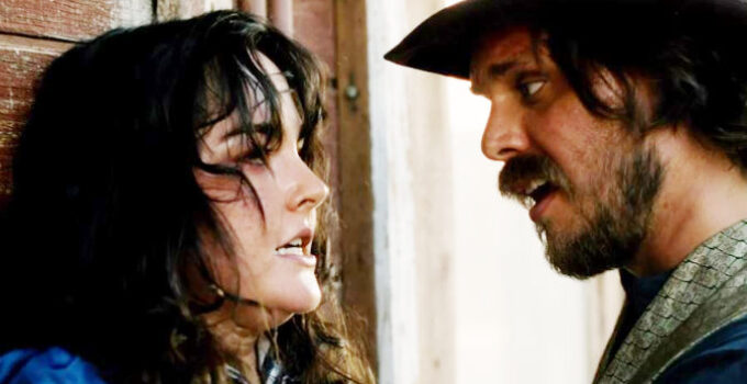 Jessica Taylor as Daisy Potter and Kellen Garner as Joe Goode, in a tense moment after she realizes he's not a whiskey drummer in Blood in Them Hills (2025)