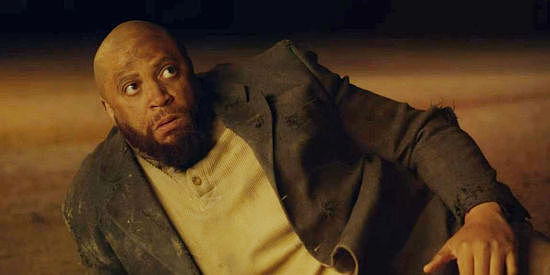 R. Marcus Taylor as Roy, caught off guard by Rose Jenning's fighting ability in Black Creek (2024)