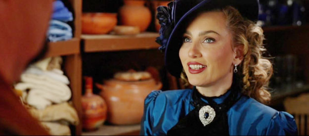 Tatiana Neva as Sybil Malone, taking a liking to Max, the sranger who arrives in Goldwood in The Wide West (2025)