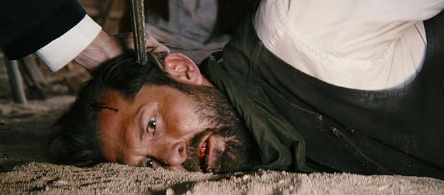 Tony Noto as the Thief, in another tough spot with a gun to his head in The Company of Thieves (2025)