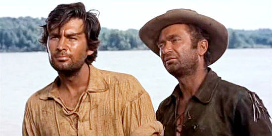 Fess Parker as Davy Crockett and Buddy Ebsen as George Russel, looking for a ride down the river in Davy Crockett and the River Pirates (1956)