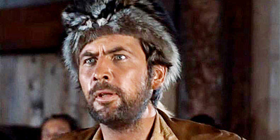 Fess Parker as Davy Crockett, wondering what the heck George is doing riding a chandelier in Davy Crockett and the River Pirates (1956)