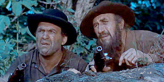 Frank Richards as Little Harpe and Paul Newlan as Big Harpe, pirates on the watch for trouble in Davy Crockett and the River Pirates (1956)