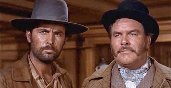 Fess Parker as Davy Crockett and Jeff York as Mike King, ready to set a trap for the pirates in Davy Crockett and the River Pirates (1956)