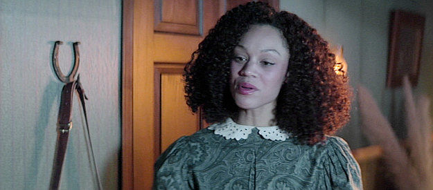 Brooklyn Wilkes as Hope, doing her best to avoid answering Valerie's questions about Redemption in Gunslingers (2025)