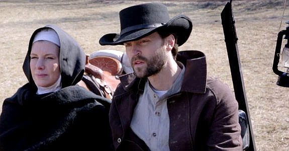 Charlotte Crumm as Sister Martha and Scott Lucas as Owen Hayes, finding the home of Martha's brother deserted in Demon's Vale (2024)