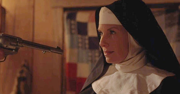 Charlotte Crumm as Sister Martha, facing Owen Hayes' six-gun in Demon's Vale (2024)