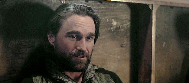 Forrest Wilder as Kid, inquiring about Thomas's past during a lull in the gunfire in Gunslingers (2025)