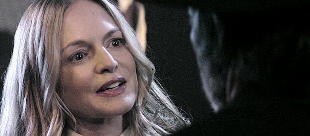 Heather Graham as Valerie Keller, explaining how she wound up in Redemption in Gunslingers (2025)