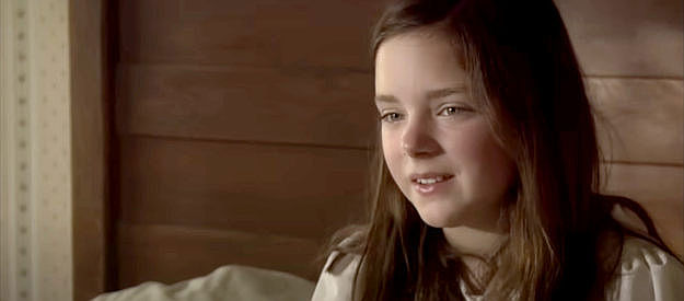 Madison Davenport as Caroline, eagerly awaiting the return of her parents in The Attic Door (2009)
