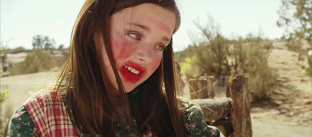 Madison Davenport, wearing makeup, applied by her brother, for the first time in The Attic Door (2009)