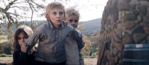 Molly's younger children, played by Amahlia Olsson, Jobe Zammit-Harvey and Nash Zammit-Harvey, when a wild bull shows up in The Legend of Molly Johnson (2021)