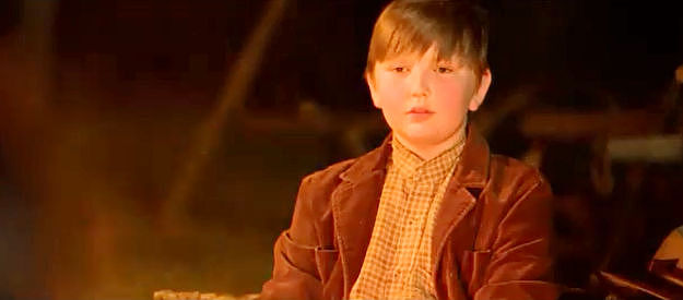 Noah Deavers as Billy Hayes, aka Lil Bit, listening to his dad talk about California in Was Once a Hero (2024)