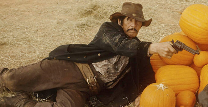 Robert Bronzi as Link Maddock, in a pumpkin patch showdown in Bury 'Em Deep (2025)
