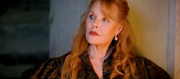 Rebecca Holden as Millie, the former saloon singer who arouses Malcolm Hunter's memory in Was Once a Hero (2024)