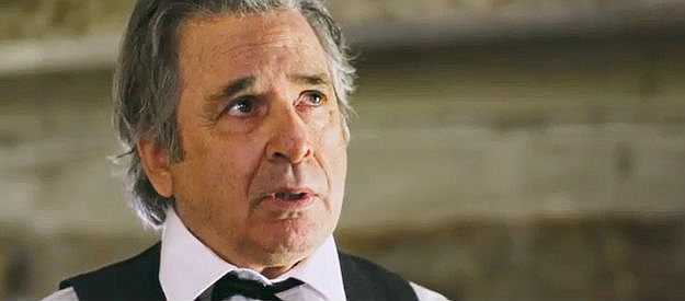 Robert Carradine as Doc Jennings, witnessing Malcolm Hunter's confused state of mind in Was Once a Hero (2024)