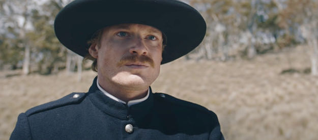 Sam Reid as Sgt. Nate Klintoff, finding himself with multiple murders to solve no sooner than he assumes his new post in The Legend of Molly Johnson (2021)