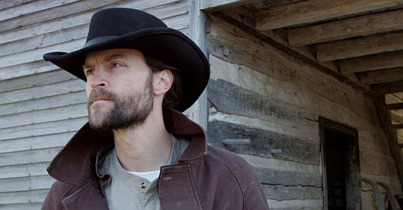 Scott Lucas as Owen Hayes, trying to figure out why the town of Glen Fork is deserted in Demon's Vale (2024)