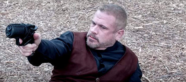 Thom Hallum as Casey Reynolds, trying to take down a Manslayer in Andromeda 1883 (2024)