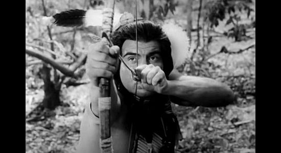 Ned Romero as the Cheyenne warrior, demonstrating his skill with a bow and arrow in The Talisman (1966)