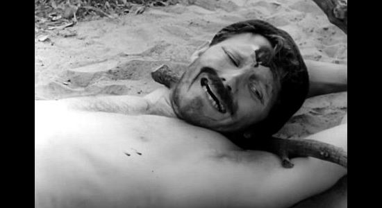 Robert Brown as Martineau, about to experience the bite of a snake and a Cheyenne warrior's vengeance in The Talisman (1966)