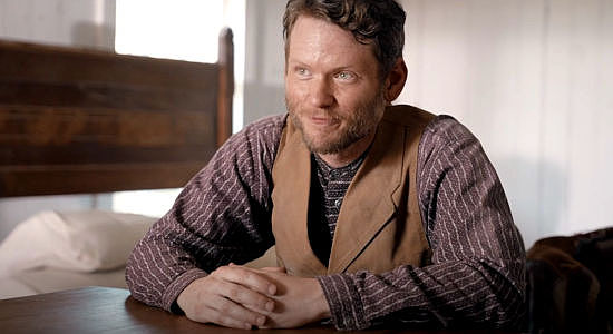 Gabriel Pranter as Chris Haag, Rosa's brother, who has already settled in Kansas with his wife in Sod & Stubble (2025)