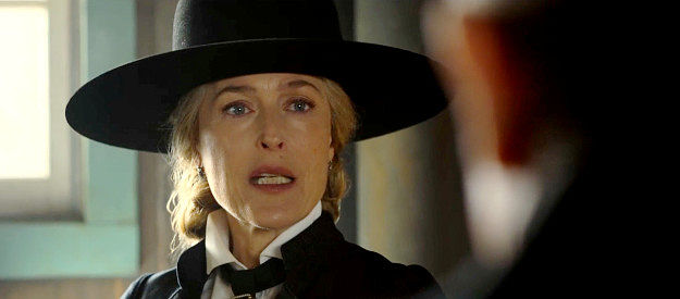 Gillian Anderson as Constance Van Ness, explaining the importance of her mines to the fate of Angel's Ridge in The Abandons (2025)