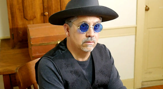 Mark Polonia as Mr. Malcolm, town administrator, with stolen bank loot hidden in his office in Once Upon a Time in Amityville (2024)