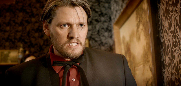 Matt Mascaro as 'Bloody' Ben Harris, looking for the man wearing his hat and using his name in The Counterfeit Kid (2023)