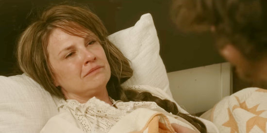 Megan Ward as Kate Teller, on her death bed and talking to her son in Teller's Camp (2023)