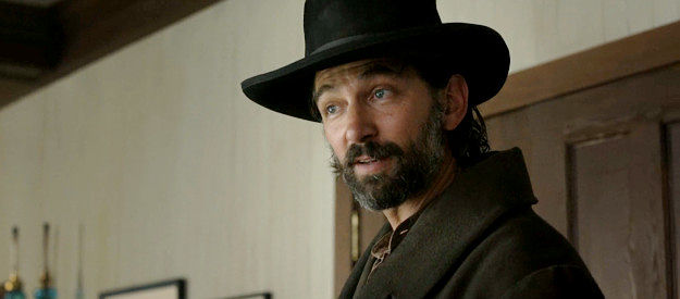 Michiel Huisman as Roache, the outlaw leader Constance Van Ness hires to help locate a missing son in The Abandons (2025)