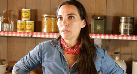 Natalie HImmelberger as Angela Barnes, being questioned by the bounty hunters in Once Upon a Time in Amityville (2024)