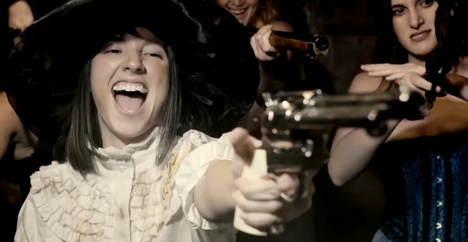 Paula Luelmo as Mia Falcon and the whores, taking out their anger on a saloon full of men in Vengeance Turns (2023)