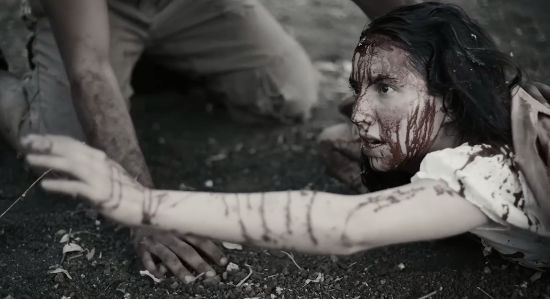 Paula Luelmo as Rebecca Falcon, wounded and struggling to crawl to safety in Vengeance Turns (2023)