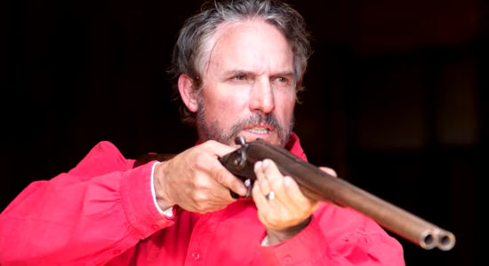 Shane Clouse as Quint Reagan, posing a threat to a crooked cattle king in Eye for an Eye (2022)