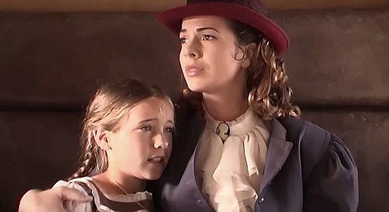 Stephanie Northrup as Annie McBride, bound for a new life with daughter Sarah (Tiare Empey) before bandits attack in Vengeance Trail (2006)