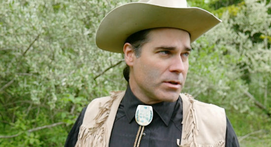 Titus Himmelberger as Miles Oakley, proclaiming the outskirts of town 'creepy' in Once Upon a Time in Amityville (2024)