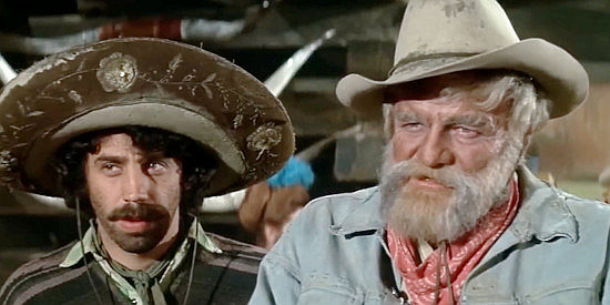 Alfonso Arau as Paco and Brian Keith as Scandalous John order whiskey in the Old West tourist town in Scandalous John (1969)