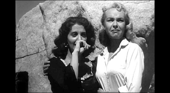 Caroll Montour as Maria San Carlos and Shirley Tegge as Joanne, watching a duel with whips in Half Way to Hell (1960)